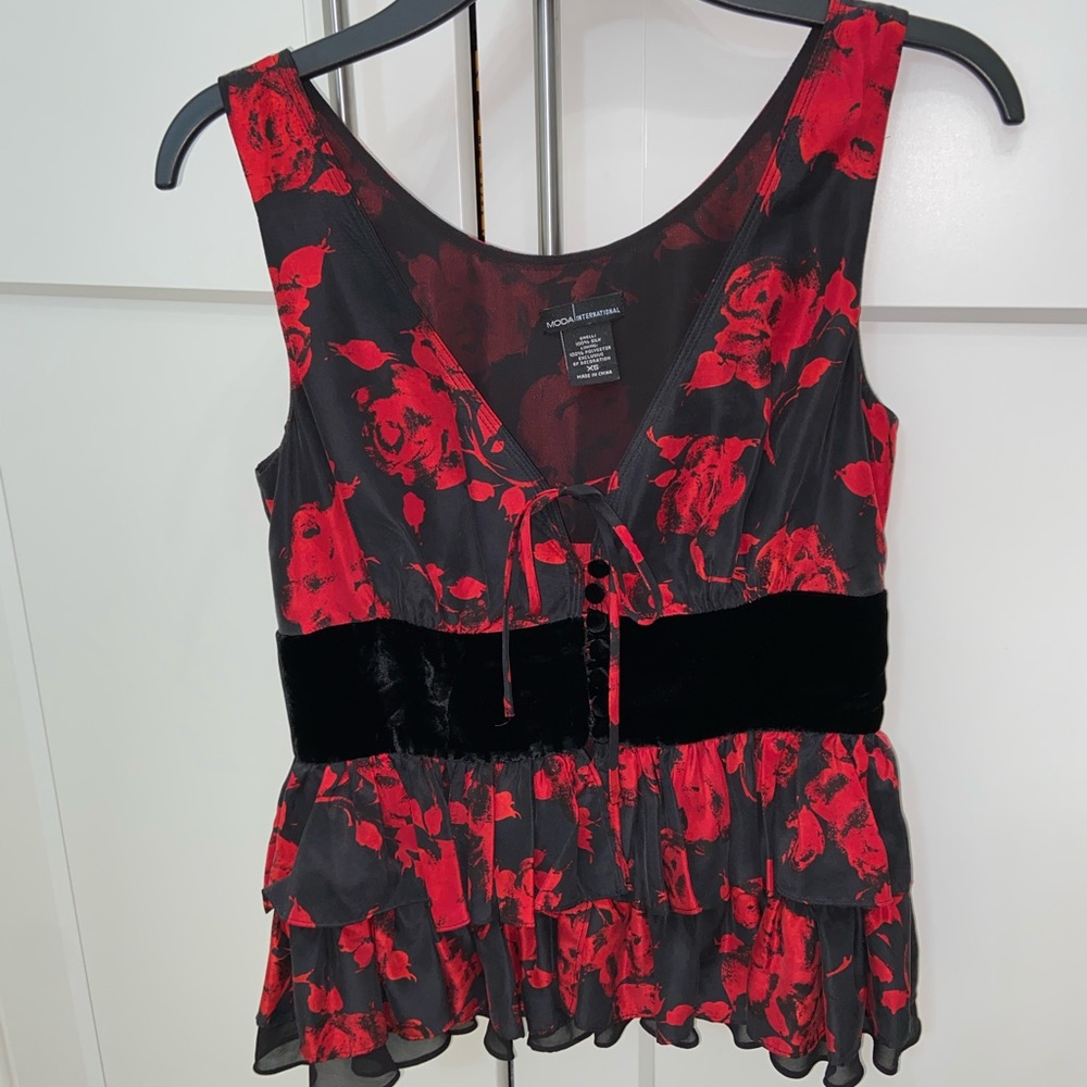 Beautiful Moda International Peplum Ruffle Top.